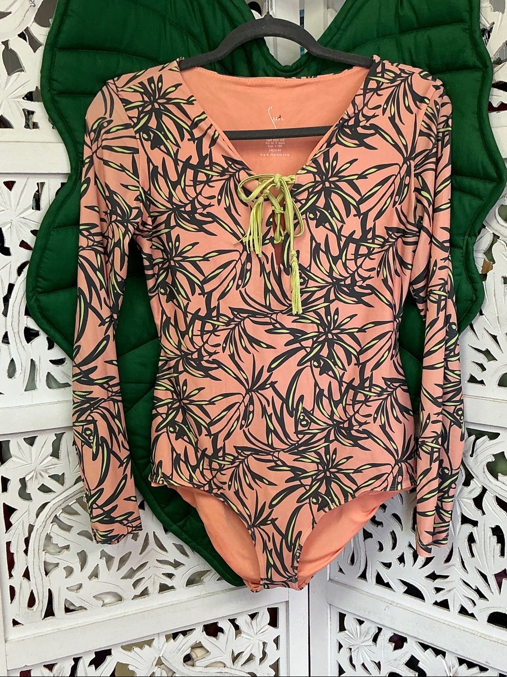 Seea peach tropical print long sleeve one piece surf suit. Size M